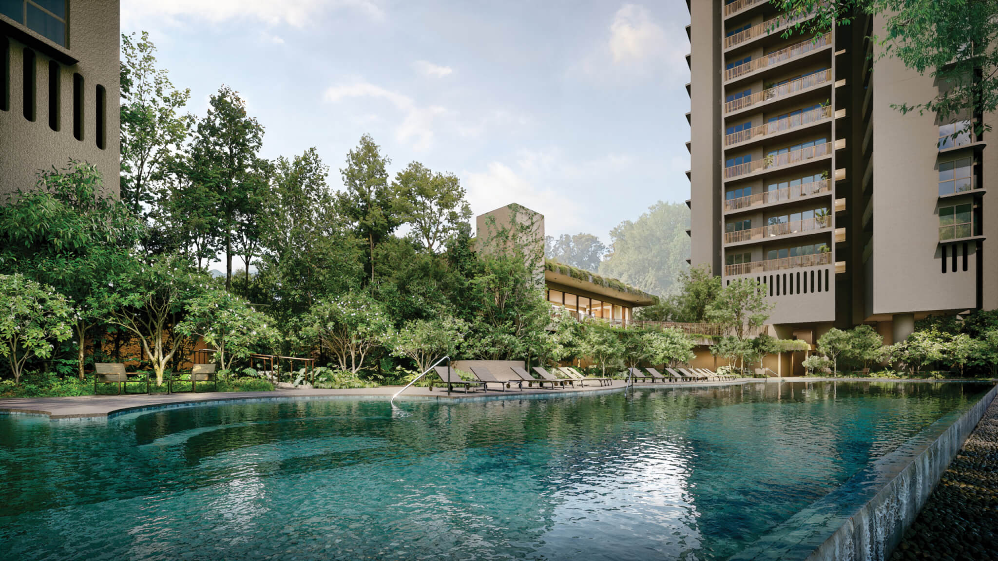 Swimming pool at River Modern condominium surrounded by landscaped greenery